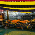 Kathmandu, Nepal - October 2021: Reclining statue of Vishnu as Narayan, the creator of all life in Budhanilkantha on October 5, 2021 in Kathmandu, Nepal.